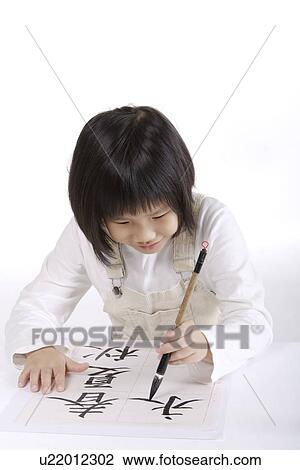 Girl practicing calligraphy View Large Photo Image Stock Image - Girl practicing calligraphy. Fotosearch