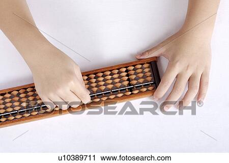 Girl using abacus, focus on hands View Large Photo Image Stock Image - Girl using abacus, focus on hands. Fotosearch