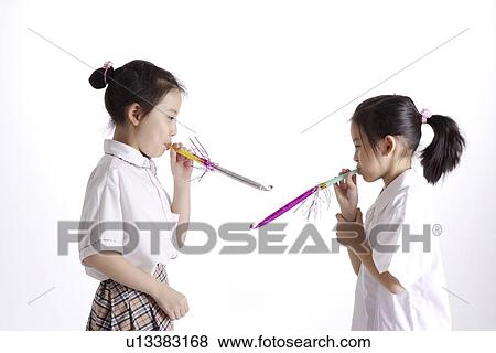 Girls with Party Horn Blower, portrait View Large Photo Image Stock Photo - Girls with Party Horn Blower, portrait. Fotosearch