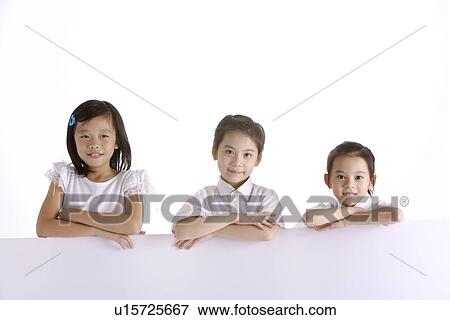 Three girls sitting smiling, portrait View Large Photo Image Stock Photo - Three girls sitting smiling, portrait. Fotosearch