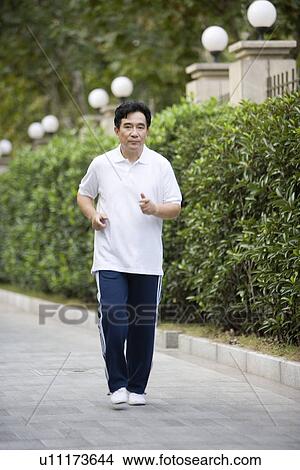 Picture - Senior man jogging outdoors. Fotosearch