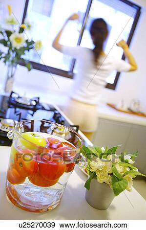 Young woman in kitchen room View Large Photo Image Stock Photo - Young woman in kitchen room. Fotosearch
