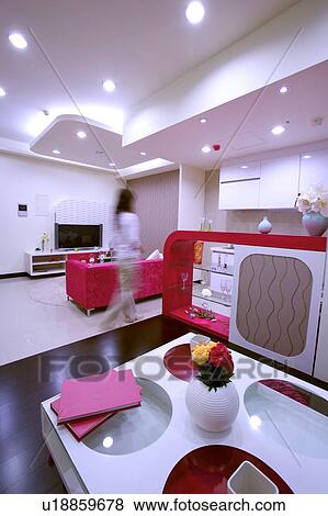 Young woman in modern style room View Large Photo Image Stock Photo - Young woman in modern style room. Fotosearch