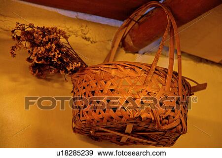 Stock Photo - Bamboo basket with wildflowers. Fotosearch