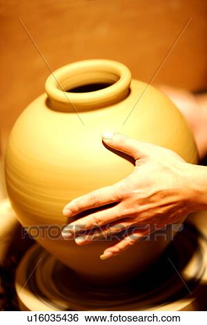 An finishing earthen pot on pottery's wheel View Large Photo Image Stock Photograph - An finishing earthen pot on pottery's wheel. Fotosearch
