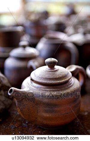 Ceramic pots, teapot in foreground View Large Photo Image Stock Image - Ceramic pots, teapot in foreground. Fotosearch