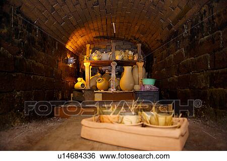 Stock Photograph - Clay potteries in ceramic kiln. Fotosearch