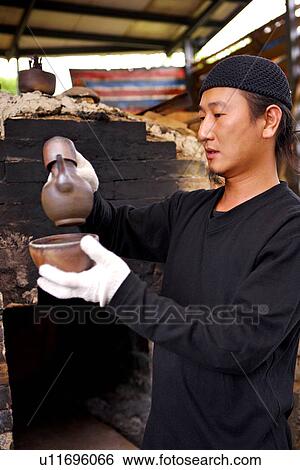 Potter examining pots View Large Photo Image Stock Photograph - Potter examining pots. Fotosearch
