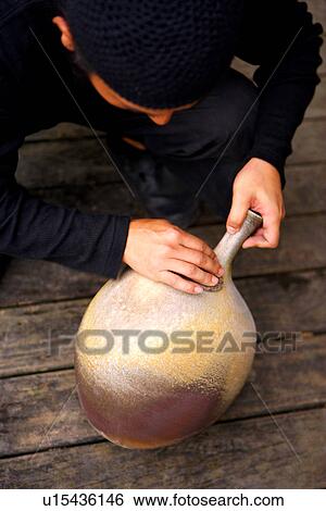 Potter grinding ceramic pot View Large Photo Image Stock Photograph - Potter grinding ceramic pot. Fotosearch