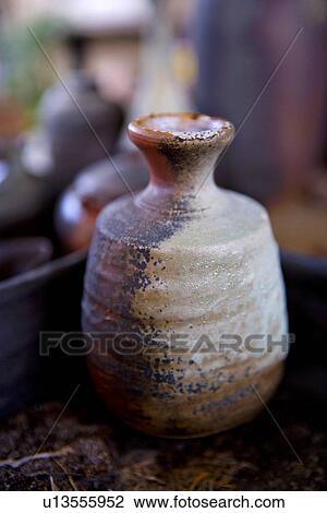 Single ceramic pot with coal ash View Large Photo Image Stock Image - Single ceramic pot with coal ash. Fotosearch