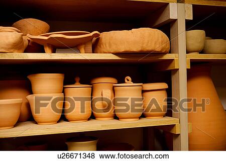 Unglazed wares on shelf, close up View Large Photo Image Stock Photo - Unglazed wares on shelf, close up. Fotosearch