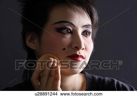 Picture - Chinese traditional opera character making-up. Fotosearch