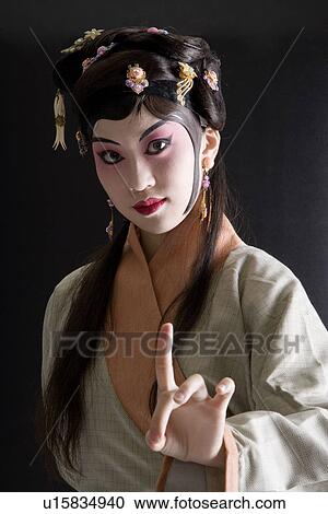 Stock Image - Female performer, portrait, close-up, side view. Fotosearch