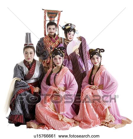 Stock Image - Five persons wearing traditional clothing. Fotosearch