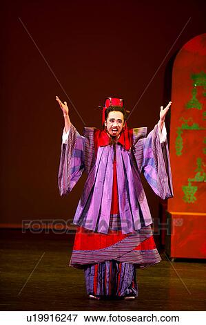Male opera performer with hands raised on stage View Large Photo Image Stock Photo - Male opera performer with hands raised on stage. Fotosearch