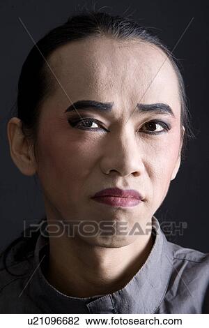 Stock Image - Male performer in stage make-up. Fotosearch