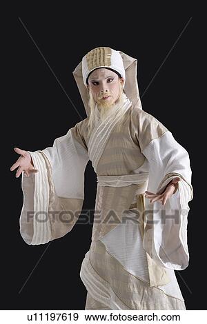 Portrait of a mid adult man wearing traditional clothing View Large Photo Image Stock Photo - Portrait of a mid adult man wearing traditional clothing. Fotosearch