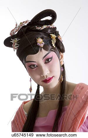 Stock Photo - Portrait of Beijing opera performer in traditional dress and make up. Fotosearch