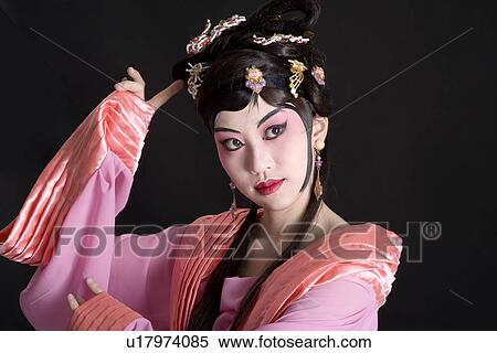 Stock Photography - Portrait of Beijing opera performer in traditional dress and make up. Fotosearch