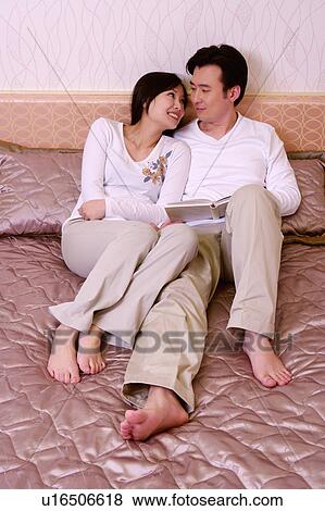 Stock Photo - Couple on bed. Fotosearch