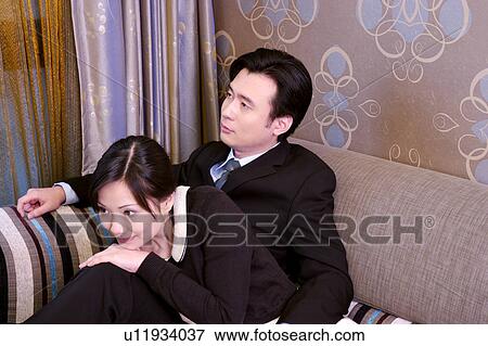 Couple on sofa View Large Photo Image Stock Photo - Couple on sofa. Fotosearch