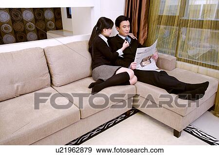 Couple on sofa View Large Photo Image Stock Photo - Couple on sofa. Fotosearch