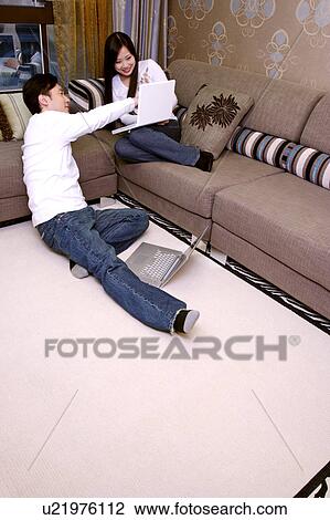 Couple with laptops View Large Photo Image Stock Image - Couple with laptops. Fotosearch