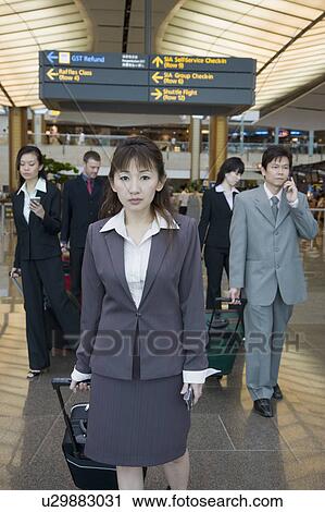 Business executives leaving an airport View Large Photo Image Stock Image - Business executives leaving an airport. Fotosearch