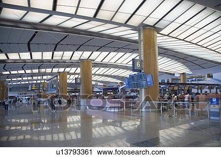 Group of people at an airport lounge View Large Photo Image Stock Image - Group of people at an airport lounge. Fotosearch