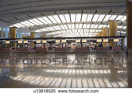 Stock Image - Interiors of an airport. Fotosearch