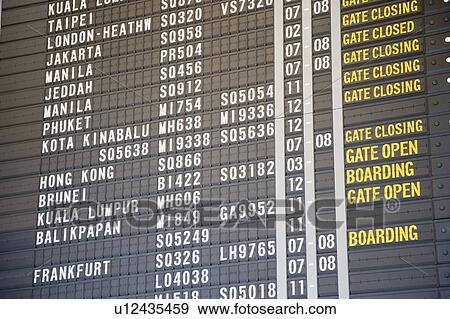 Stock Photo - Close-up of an arrival departure board at an airport. Fotosearch