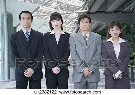 Portrait of four business executives standing side by side View Large Photo Image Stock Image - Portrait of four business executives standing side by side. Fotosearch