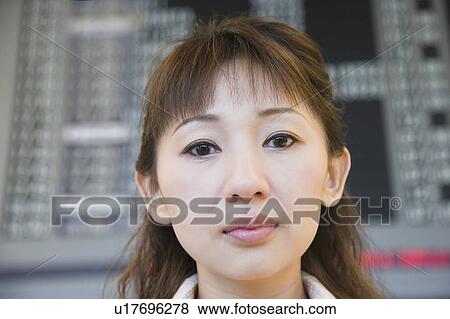 Stock Photo - Close-up of a businesswoman at an airport. Fotosearch
