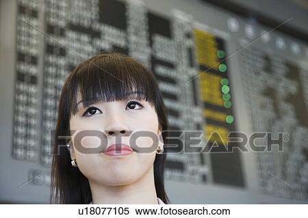 Close-up of a businesswoman at an airport View Large Photo Image Stock Photography - Close-up of a businesswoman at an airport. Fotosearch