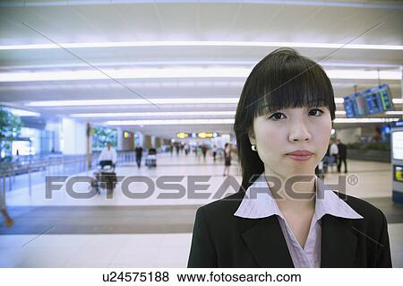 Portrait of a businesswoman at an airport View Large Photo Image Stock Photo - Portrait of a businesswoman at an airport. Fotosearch