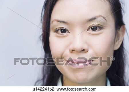 Portrait of a businesswoman smirking View Large Photo Image Stock Image - Portrait of a businesswoman smirking. Fotosearch