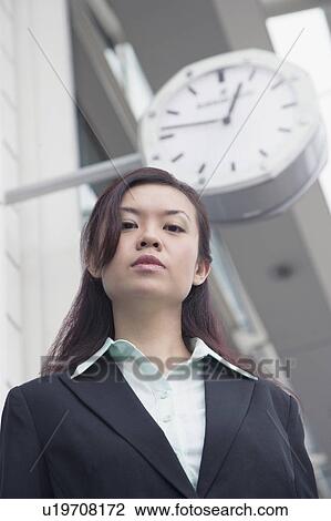 Low angle view of a businesswoman standing at an airport lounge View Large Photo Image Stock Image - Low angle view of a businesswoman standing at an airport lounge. Fotosearch
