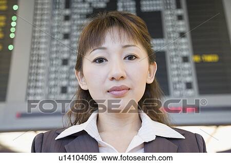 Portrait of a businesswoman at an airport View Large Photo Image Stock Photography - Portrait of a businesswoman at an airport. Fotosearch