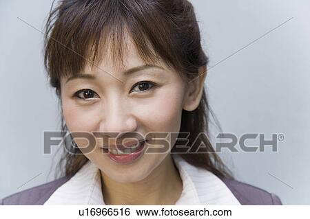 Stock Photograph - Portrait of a businesswoman smiling. Fotosearch