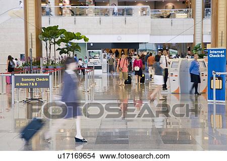 Side profile of a businesswoman leaving an airport View Large Photo Image Picture - Side profile of a businesswoman leaving an airport. Fotosearch