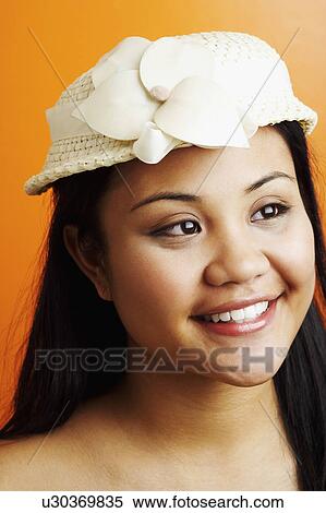 Stock Photography - Close-up of a young woman smiling. Fotosearch