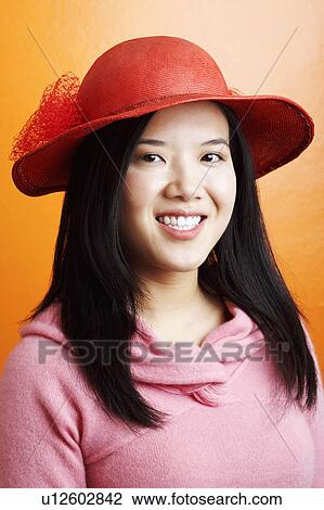 Portrait of a young woman smiling View Large Photo Image Stock Image - Portrait of a young woman smiling. Fotosearch