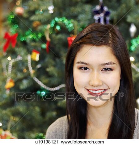 Portrait of a young woman smiling View Large Photo Image Stock Image - Portrait of a young woman smiling. Fotosearch
