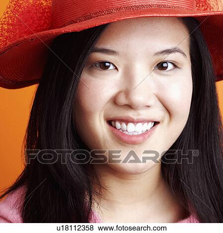 Portrait of a young woman smiling View Large Photo Image Stock Photo - Portrait of a young woman smiling. Fotosearch