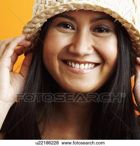 Stock Photo - Portrait of a young woman smiling. Fotosearch