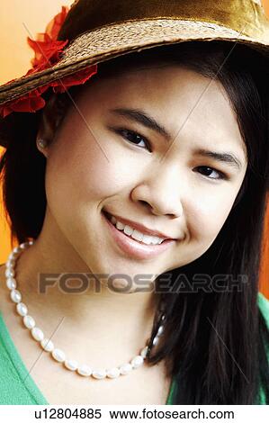 Stock Photography - Portrait of a young woman smiling. Fotosearch