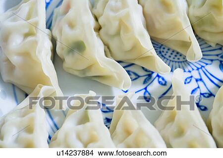 Picture - Close-up of Chinese dumplings on a plate. Fotosearch