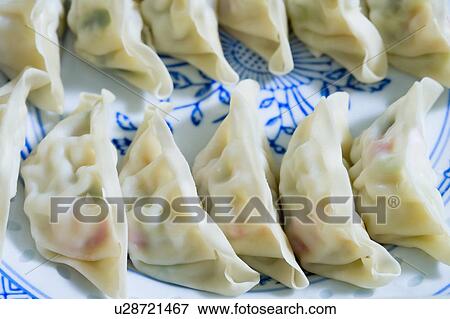 Stock Photo - Close-up of Chinese dumplings on a plate. Fotosearch