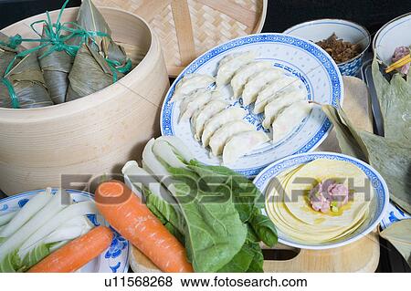 Stock Photo - Close-up of Chinese dumplings with carrots and bok choys. Fotosearch