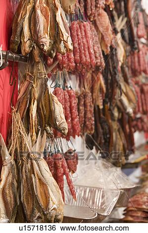 Close-up of a dried fish and sausages at a market stall View Large Photo Image Stock Photograph - Close-up of a dried fish and sausages at a market stall. Fotosearch